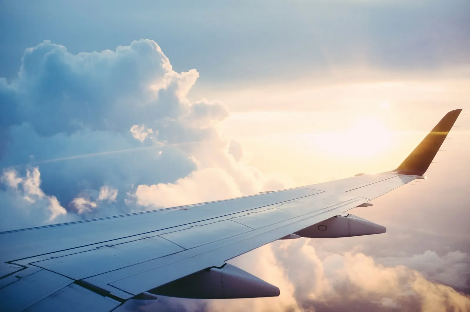 View from an aircraft window above the clouds
