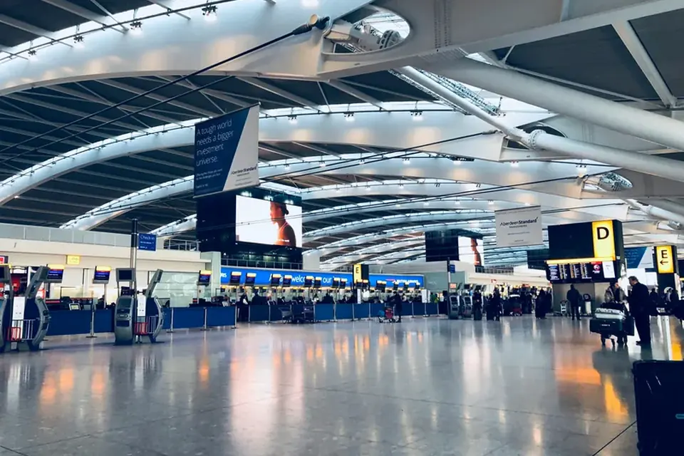 Bright airport terminal departures hall – Whitechapel to Gatwick transfer