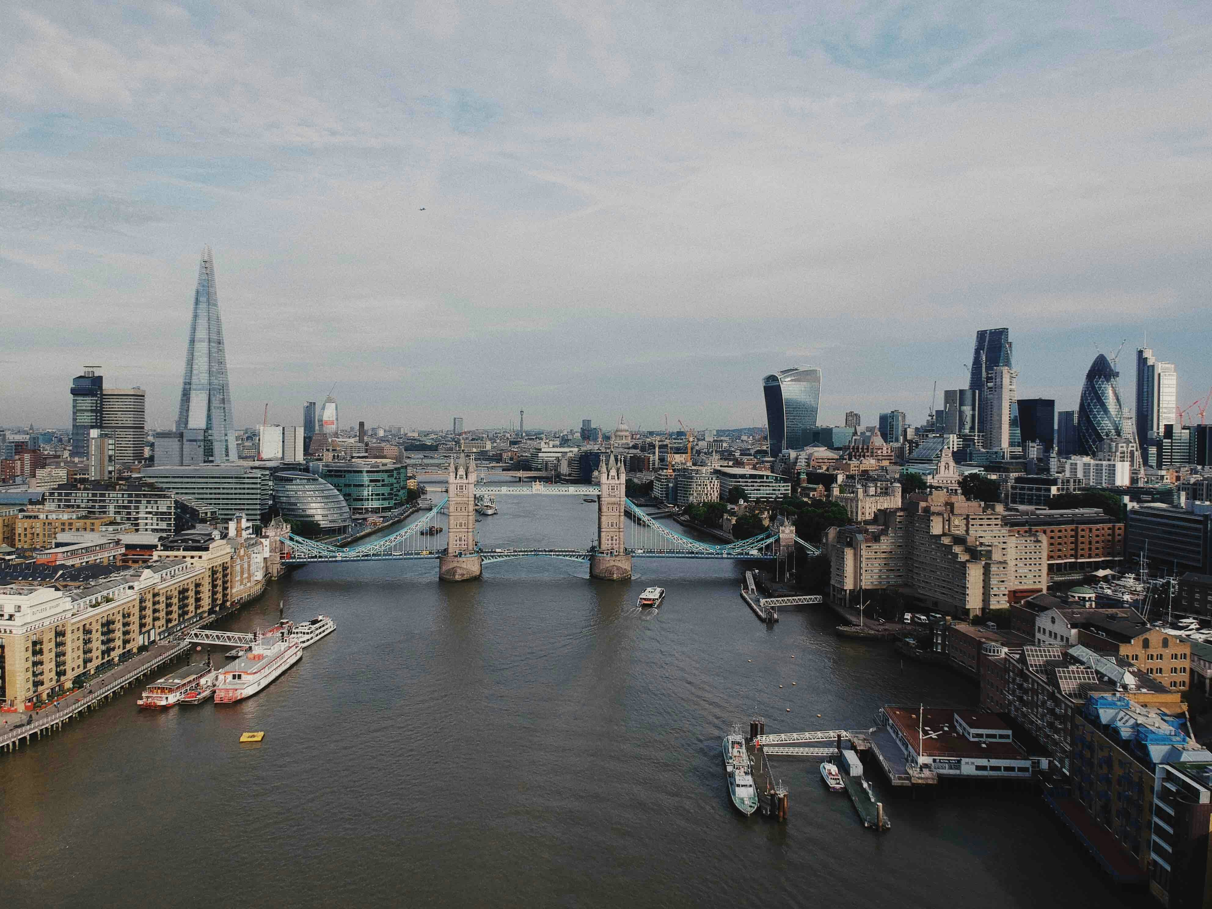 Aerial view of Tower Bridge and the Thames through central London — the postcard berth that only smaller cruise ships can actually reach